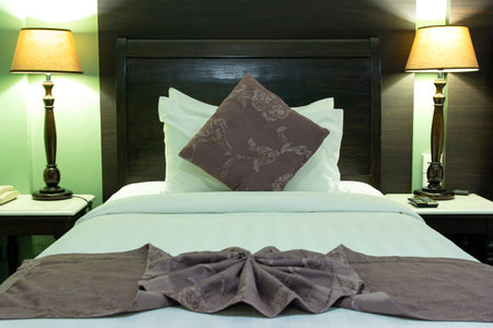 Bedroom Interior with Pillow and Table Lampの写真素材