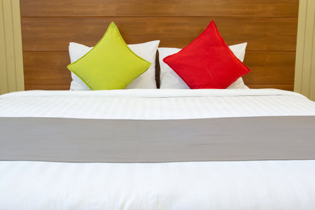 Modern bedroom interior with colorful pillow on bedの写真素材