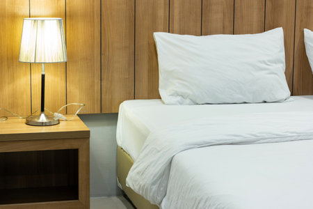 Table Lamp on Bedside in The Bedroomの写真素材