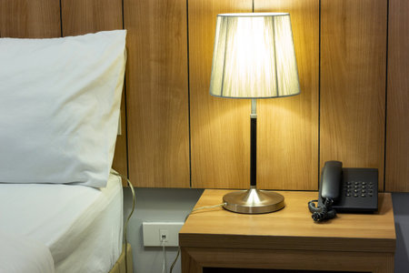 Table Lamp on Bedside in The Bedroomの写真素材