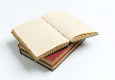 stack of open old book on white background for mockup blank templateの写真素材