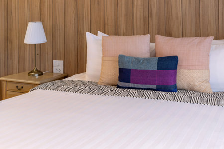 Luxurious Bedroom with Comfortable Bed, Stylish Furniture, and Soft Pillows in a Cozy Home Setting