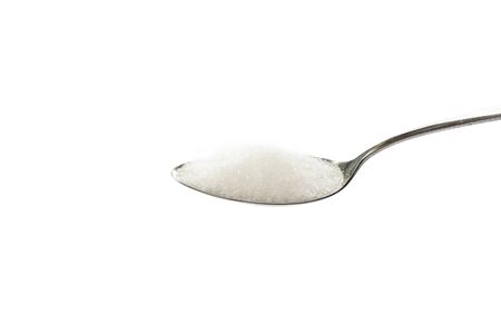sugar on a spoon on white backgroundの写真素材