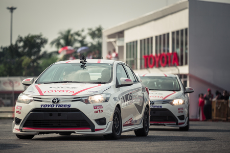 October 18, 2015: Toyota Colora Altis perform drifting on the track at the event Toyota Motor Sport show at Udon Thani, Thailand with people looking in the backgroundのeditorial素材