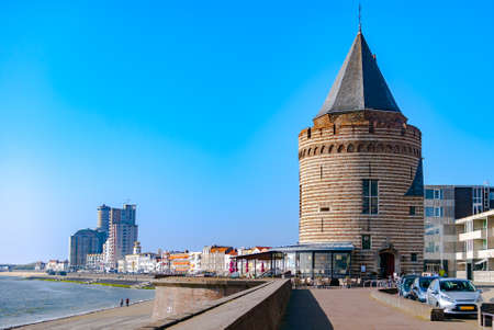 View of a northern sea resort with historical and modern buildings along the promenade. Summer or vacation concept. Travel. Seaside. Prison tower. Vlissingen, the Netherlands. Europeのeditorial素材