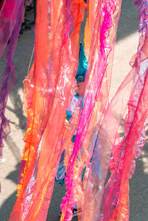 Genk, Belgium - May 1st 2019: Participants of annual O-parade. A young woman is steering a giant floating jellyfish.のeditorial素材