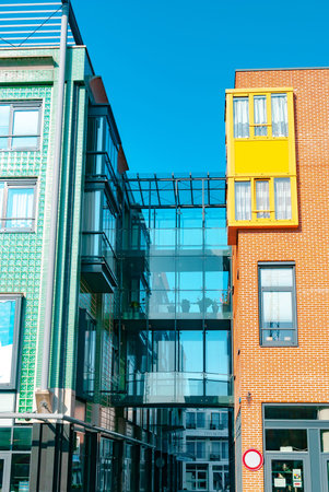 Vlissingen, the Netherlands - April 2015: Modern architecture. Glass pedestrian bridge connecting...