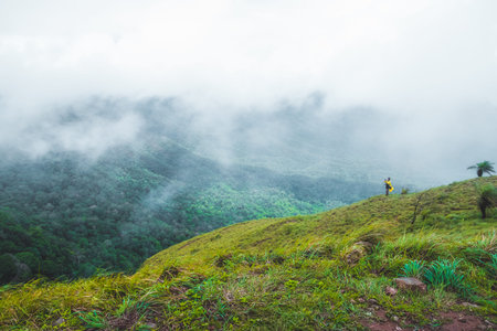 Viewpoint and green fields in the rainy season cover by fog at Doi Luang Tak, Tak Province,Thailand.