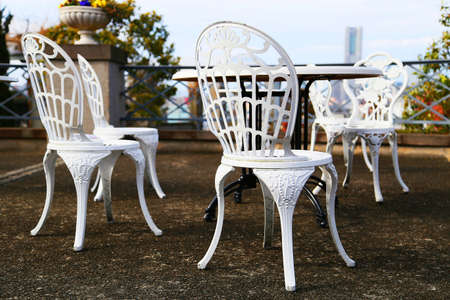 Landscape with outdoor table and chairsの写真素材