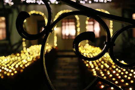 The illumination of the front door of the House and the gate and curve patternsの写真素材