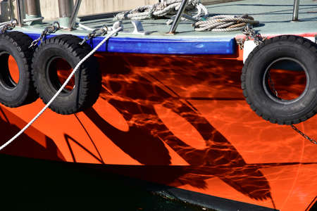 Ships anchored in the Harbor on a sunny orange light and shadowの写真素材