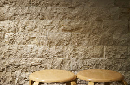 Light if illuminated wall and round Chairの写真素材