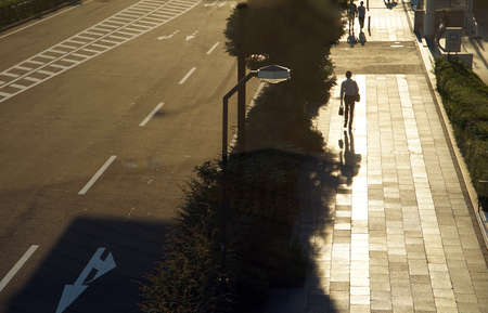 A man walking along the Japan sunset trailの写真素材