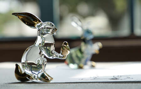 Beside the window of the room was a glass rabbit figurineの写真素材