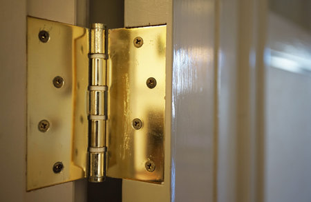 Old wooden door and hinge of the roomの写真素材