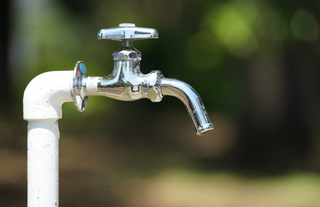 Faucet in the park drinking fountain on a sunny day