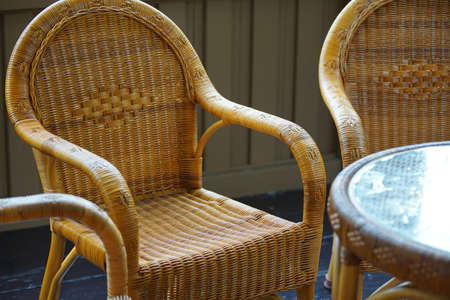 Furniture of the rattan of a chair and the table of the roomの写真素材