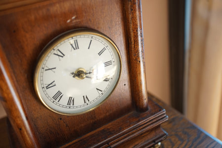 Clockface of the table clock of the wooden frame