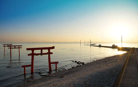 Scene of the shining shore of the morning sun where it was fine of Japanの写真素材
