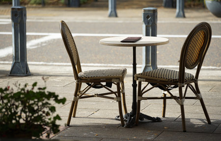 A table and chair of the cafe of the street of the town of the day when it was fine