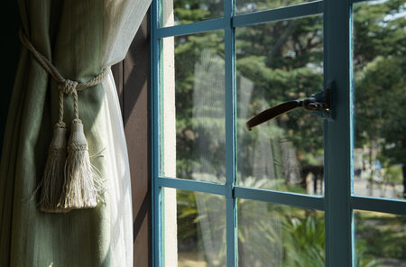Window and curtains of a room on a sunny day
