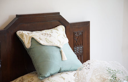 Bed pillow by the wall in the bedroomの写真素材