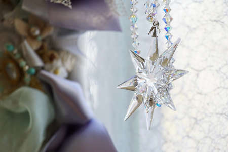 Crystal ornaments hanging in the window of the roomの写真素材