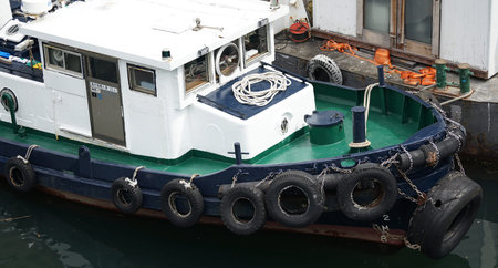 workboat bow docked in harbor with overhead viewの写真素材