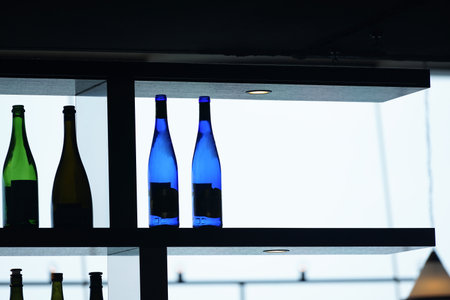 Bottles of wine on a shelf in a restaurant. Selective focusの写真素材