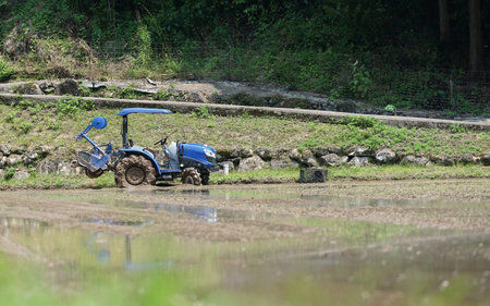 Tractor on the rice field in the countryside, japan