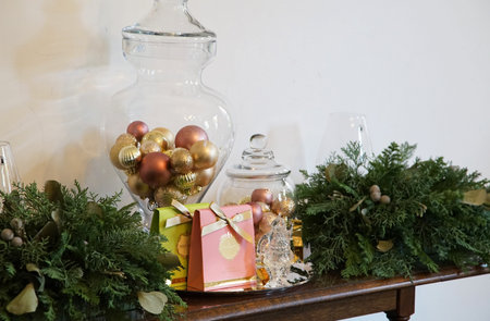 Christmas decoration with gift boxes and ornaments on the wooden table