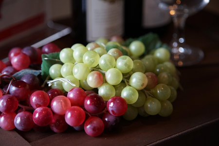 Bunch of grapes on a table in a wine cellar. Selective focus.の写真素材