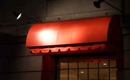 Restaurant facade at night with light. Shallow depth of fieldの写真素材