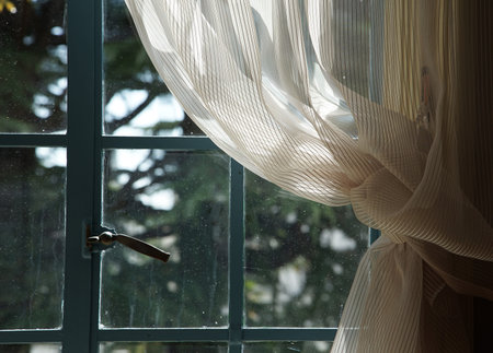 Contrast of Bright Sunlight on Translucent Fabric and Soft Greenery Outside