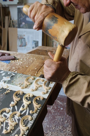 Wood carver doing his jobの写真素材