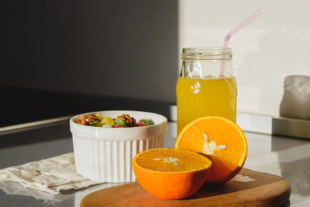 orange juice with a plate with candied fruit on the table
