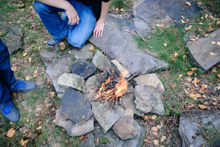 a fire in the mountains on the rocks