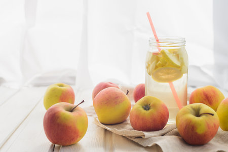 apples on a white rag on the wooden background