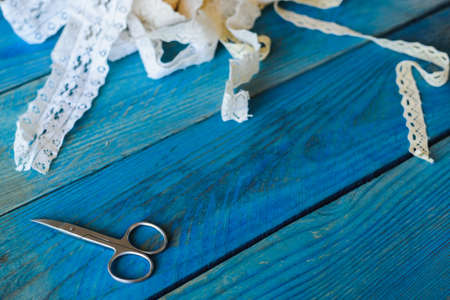 lace ribbon on wooden background, crafts conceptの写真素材