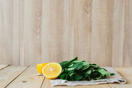 lemon and sorrel on fabric in wooden interior backgroundの写真素材