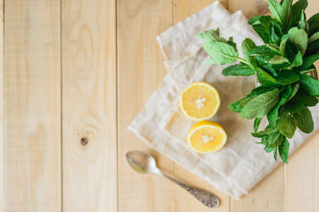 ingredients for homemade lemonade in a wooden interiorの写真素材
