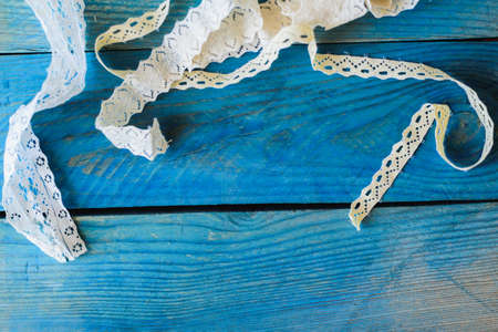 lace ribbon on wooden background, crafts conceptの写真素材