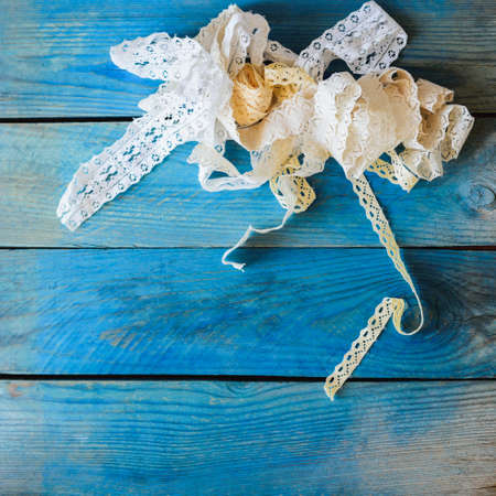 lace ribbon on wooden background, crafts conceptの写真素材