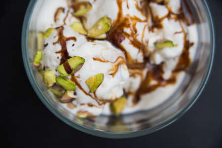 macro top view ice cream with pistachios in a mugの写真素材