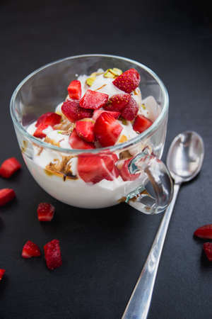 icecream in a mug with fresh strawberry harvestの写真素材