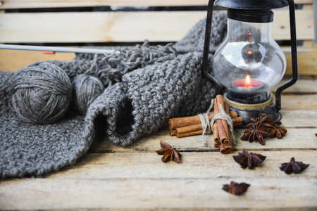 autumn comfort concept, still life of candlestick and knittingの写真素材