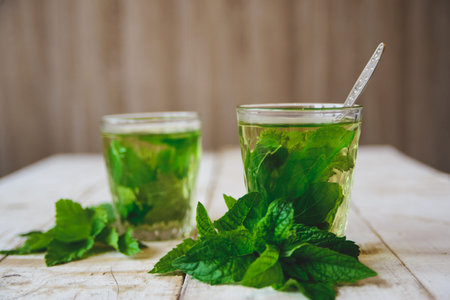 tea with mint on white wooden desk