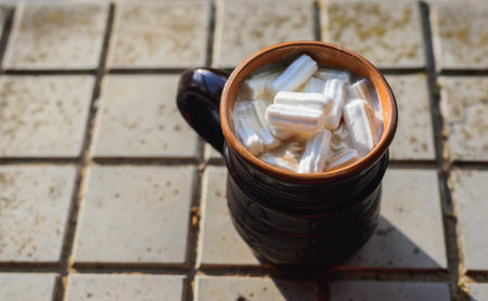 Hot cocoa with marshmallows in a clay mug