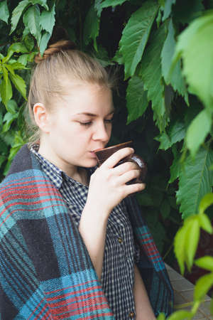 caucasian young woman drinking cocoa with marshmallowの写真素材
