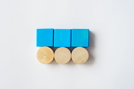 wooden squares and circles on white background with copy spase